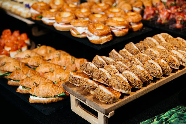 istock Assorted Mini Sandwiches and Nut-Crusted Sweets at Buffet. 2216629714