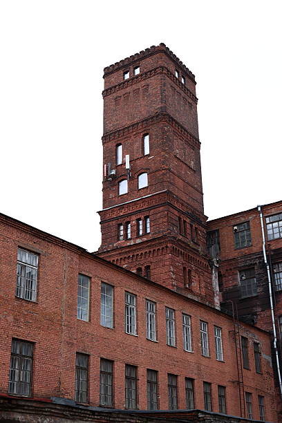 istock This is a historic red brick industrial building that features a tall tower on its design 2216631699