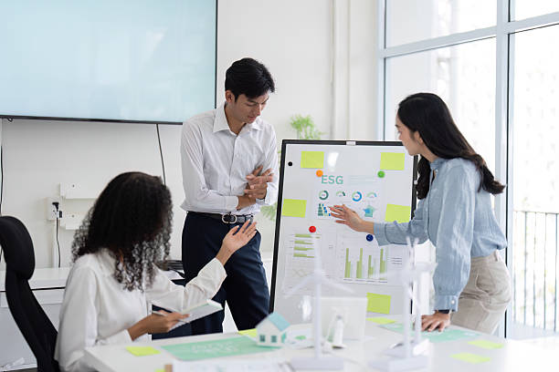 istock Sustainability and Team Collaboration. A diverse team discussing ESG strategies in a modern office setting. 2216631729