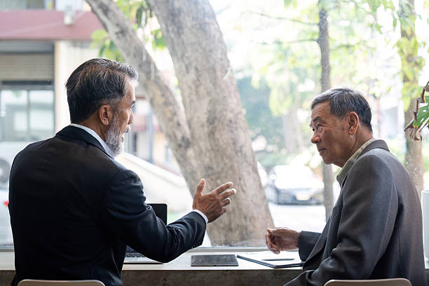 istock Elderly professionals engaged in a meaningful discussion 2216635328