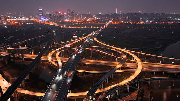 istock Multi-level overpass China. Cars drive interchange time lapse. Road traffic. 2216636200