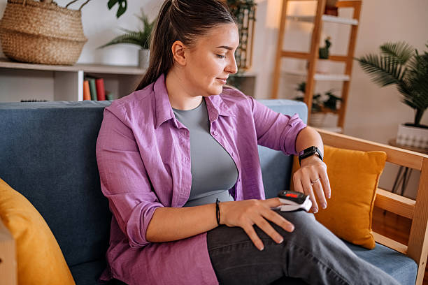 istock People checking their health at home using devices connected with smart watch 2216636545