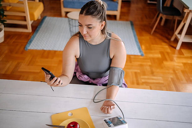 istock People checking their health at home using devices connected with mobile phone 2216636669