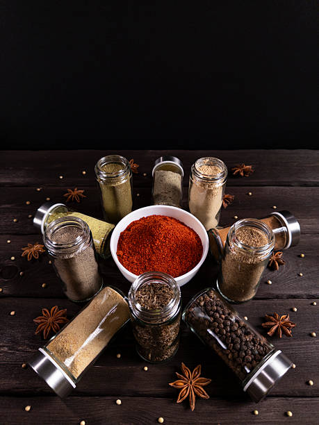 istock A beautifully arranged rustic kitchen scene featuring dried herbs, spices, and wooden kitchen tools on a textured surface 2216636935