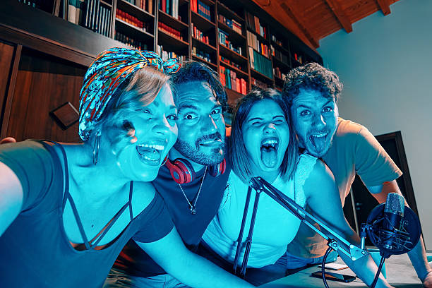 istock Young radio speakers having fun while recording podcast in home studio 2216637206