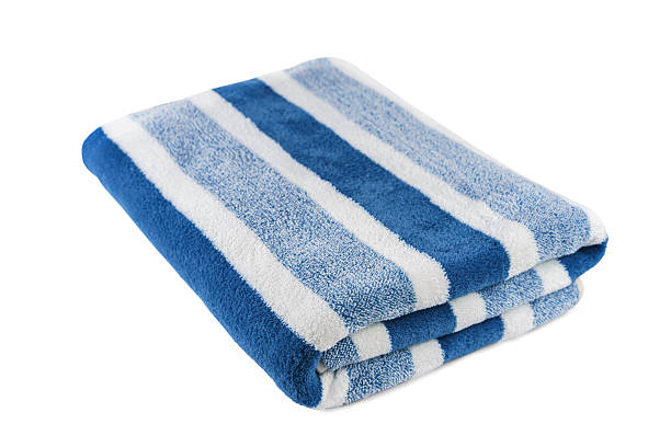 istock Carefully folded soft striped bath blue towel isolated on white background 2216637954
