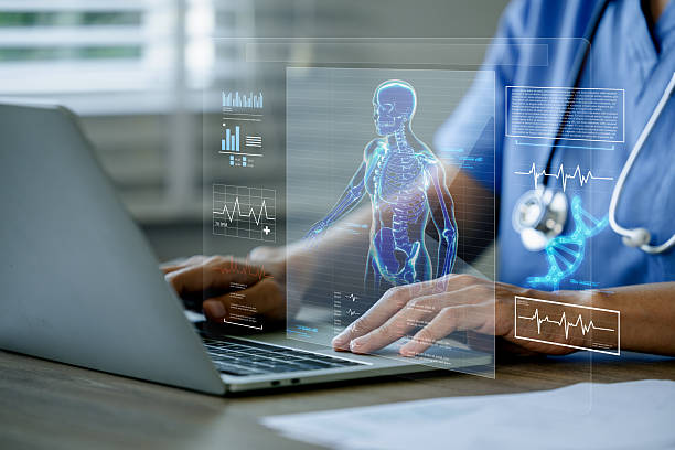 istock Doctor using a laptop with medical interface displaying a human skeleton. 2216639495