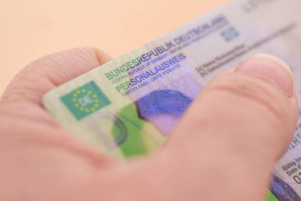 istock German identity card, document, concept obtaining German citizenship, migration law, passport control border, foreign travel, obtaining visa, Frankfurt - January, 29, 2025 2216639830