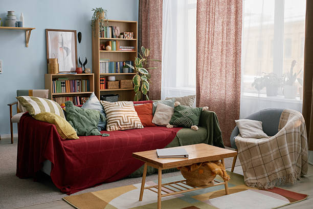 istock Cozy Living Room with Colorful Pillows and Plants 2216640645