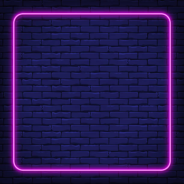 istock Square pink neon frame on brick background mockup for social media 2216645564