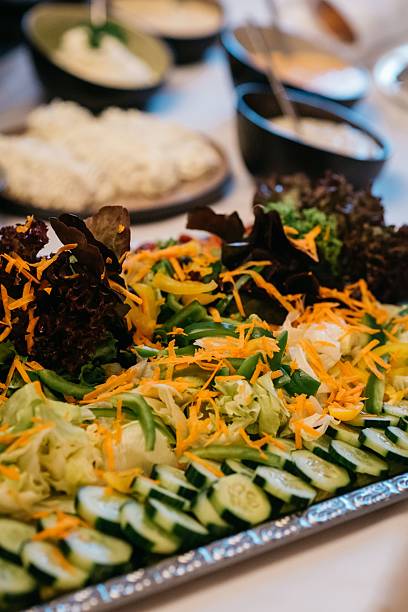 istock Fresh salad platter with cucumbers and lettuce. 2216645912
