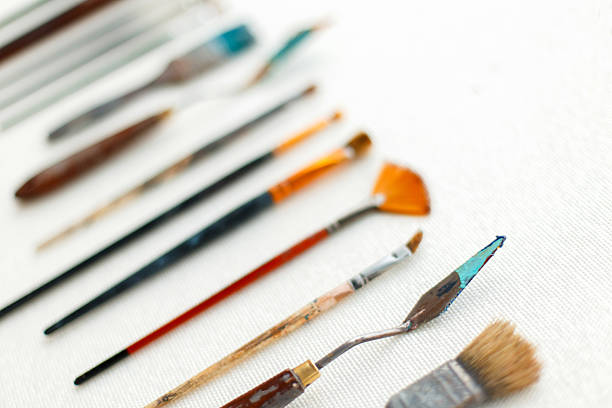istock Old brushes and artist tool on white background. Top view 2216646061