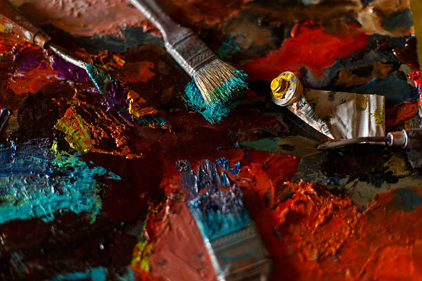 Bright colorful abstract background from oil paint with artist tools