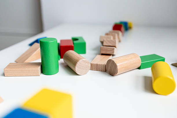 istock Colorful wooden building blocks on white surface for creative play 2216646493