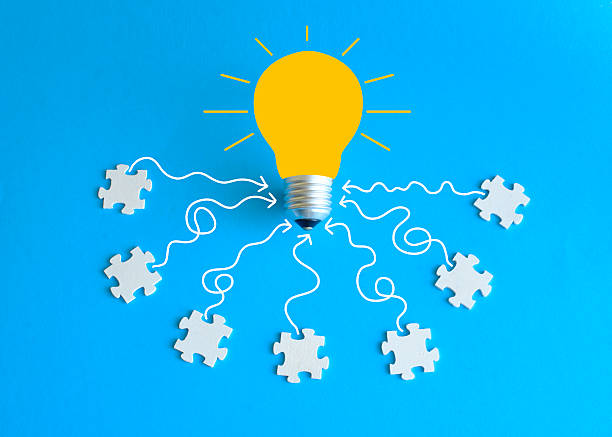 istock Business concept,collaboration,cooperation,teamwork, innovation,human resources,recruitment,team building with jigsaw puzzle pieces and lightbulb 2216647066