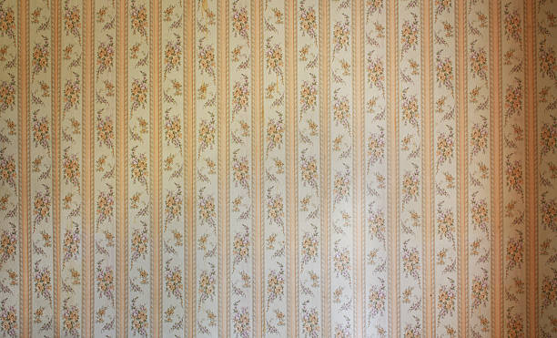 istock Old wallpaper on the wall. Old wallpaper for texture or background. 2216650855