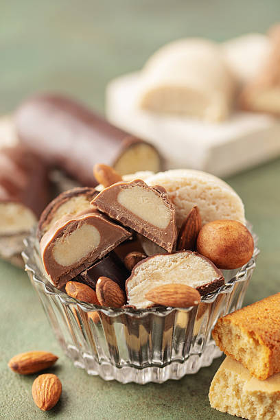 istock Different Christmas almond marzipan sweets on green background 2216655311
