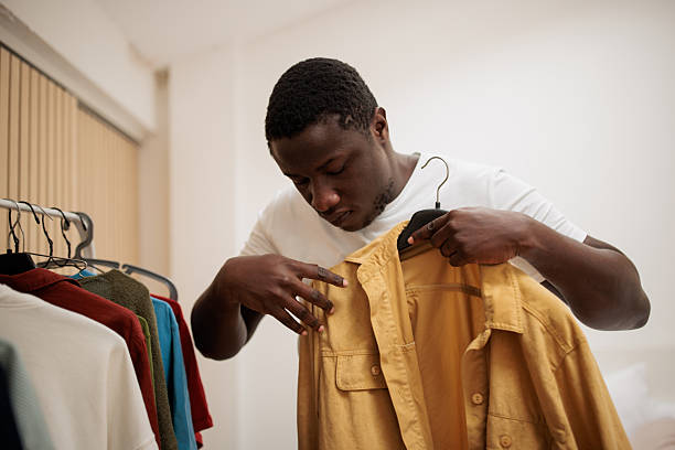 istock Man Deciding What to Wear at Home 2216656912