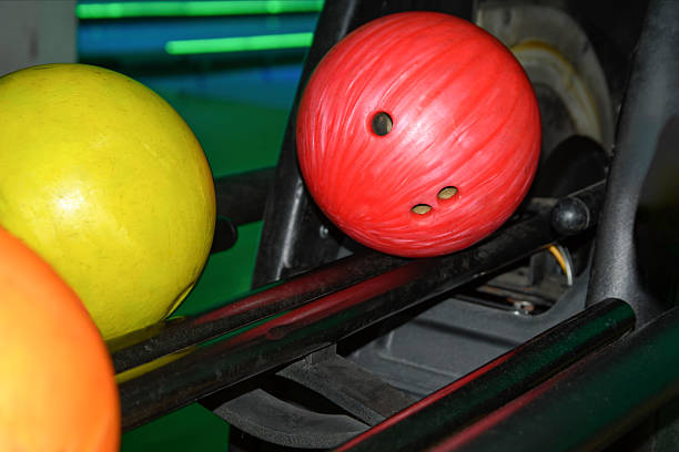 Returning the bowling ball to the rack