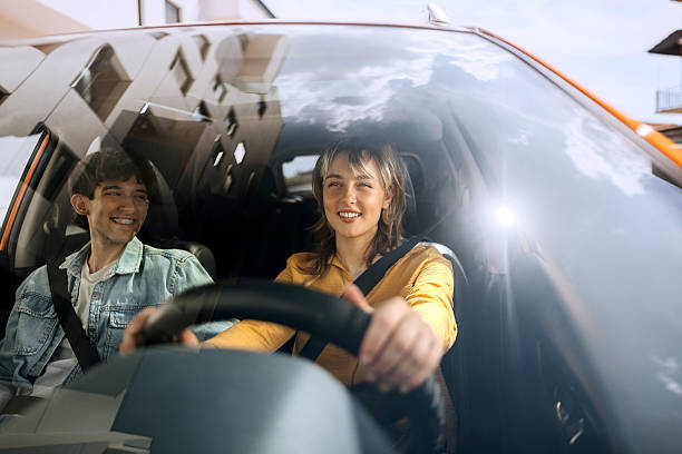 istock Young couple enjoying car drive together 2216657588