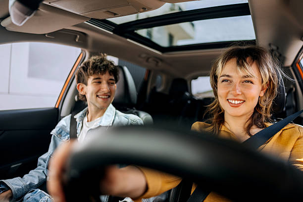 istock Young couple enjoying car drive together 2216657604