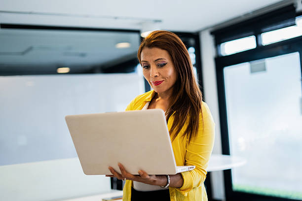 istock Businesswoman using laptop at office 2216659648