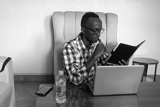 istock Gustave Iraguha Focused on Reading and Working 2216659846