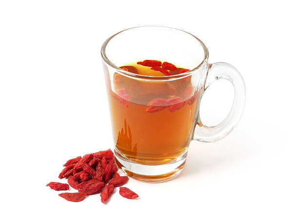 istock Cup of tea with goji berries isolated on white background 2216663831