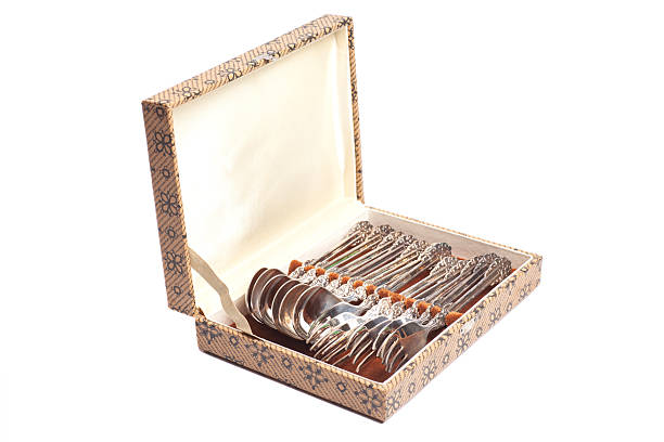 Antique cutlery spoons and forks in box.