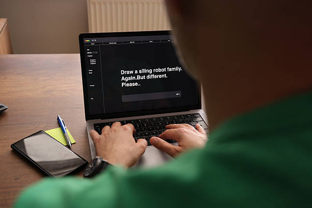 istock Human Typing AI Prompt on Laptop Screen with Typo 2216665011