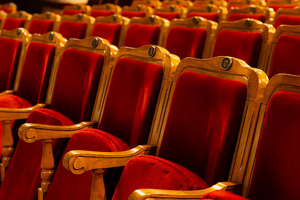 istock Row of red seats in theatre 2216671868
