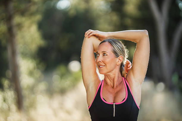 istock Woman Doing Stretching Exercises During Training In Park At Summer Day 2216672662
