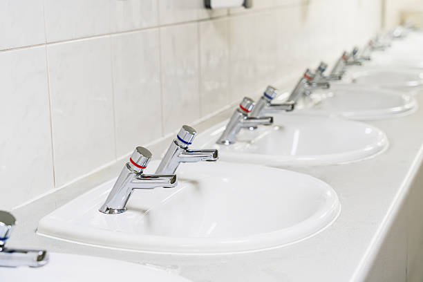 istock Separate Hot And Cold Water Taps In Public Bathroom 2216672753