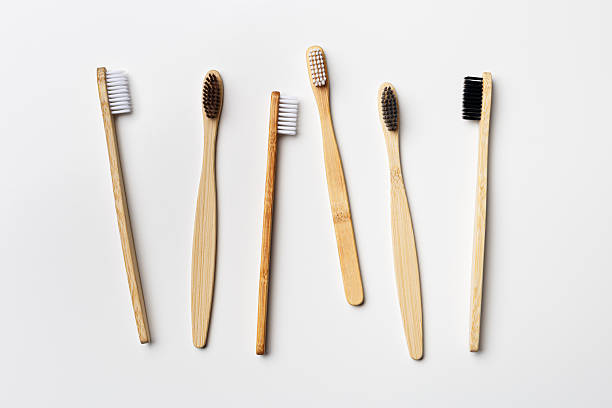 istock Top view of eco-friendly bamboo toothbrushes arranged on grey white background, emphasizing sustainability and minimalism, Natural organic bathroom beauty product concept, dental hygiene, flat lay 2216674093