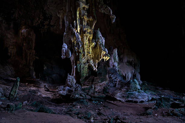 istock Mystical limestone cave chamber featuring illuminated stalactites, dramatic rock formations, and shadowy textures in a surreal underground landscape scene. 2216675355