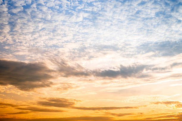 Beautiful , luxury soft gradient orange gold clouds and sunlight on the blue sky perfect for the background, take in evening,Twilight, Large size, high definition landscape photo, savanna view