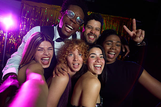 istock Cheerful friends taking a selfie at disco party 2216676089
