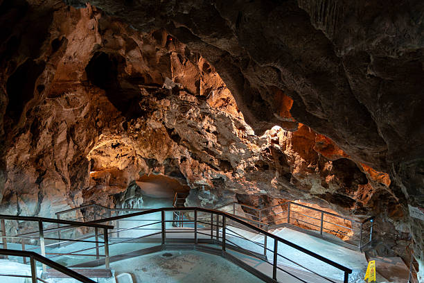 istock Stunning cave interior showcasing natural rock formations, illuminated pathways, and intricate textures, inviting exploration and adventure 2216678421