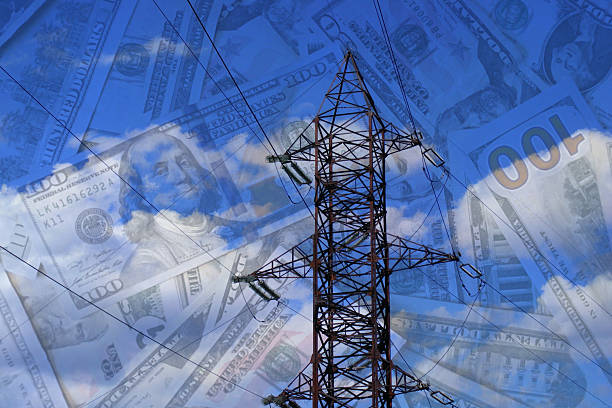 istock American dollars banknotes on electric pole background. Increasing consumption, energy crisis. Inflation. Price energy are getting more expensive annually 2216679159