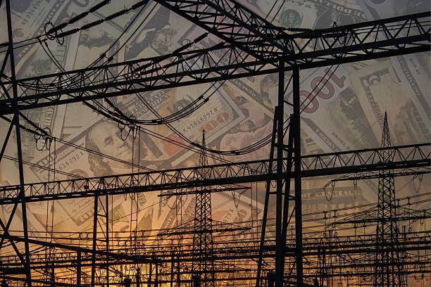 istock American dollars banknotes on electric pole and Increasing consumption energy crisis 2216679219