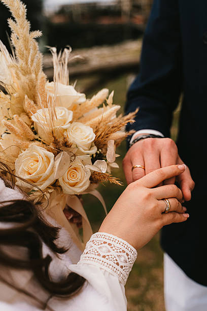 Wedding Ceremony Close-Up: Exchanging Rings and Bouquet