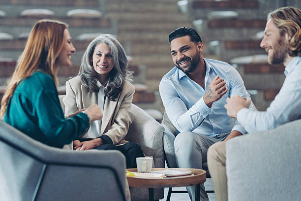 istock Group of business people sitting around a table and having a discussion 2216685363
