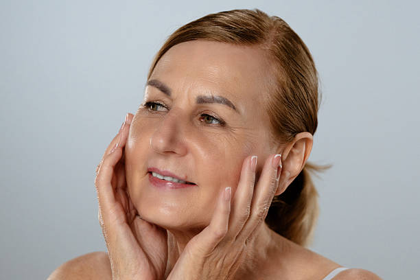 istock Thoughtful Mature Woman with Hand on Face 2216686880