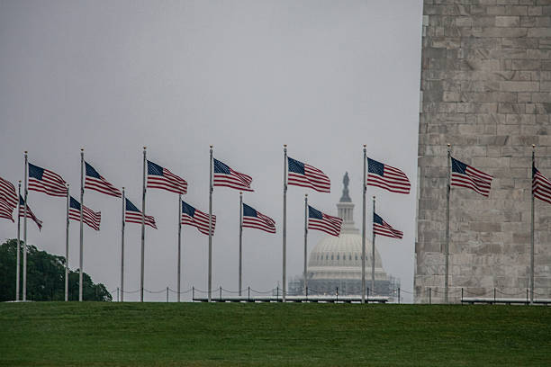 istock American Flags, Washington Monument and Capitol 2216688525