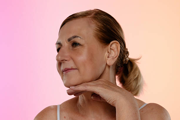 istock Thoughtful Mature Woman with Hand on Face 2216689239