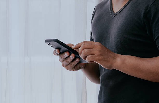 istock Man hands typing on mobile phone internet for social media, email notification and connection for search. 2216689409