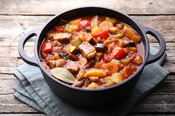 istock Delicious stew with vegetables in pot on wooden table, closeup 2216689684