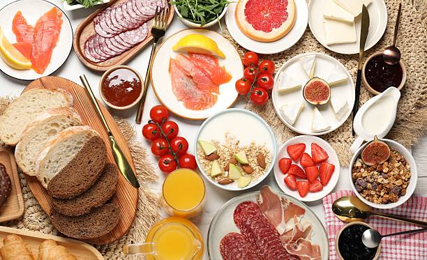 istock Different tasty food served for brunch on white table, flat lay 2216689687