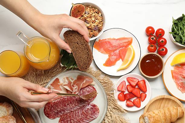 istock Woman having brunch at white table, top view 2216689713
