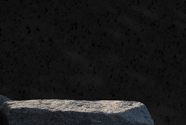 istock Rock stone podium stand display product on black wall interior room background, Studio Background with Shadow on Sea Stone mockup Stand pedestal for Cosmetic,Perfume Product Present branding 2216689724
